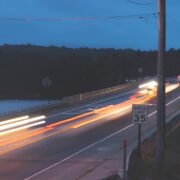 timelapse photography of vehicle passing on road